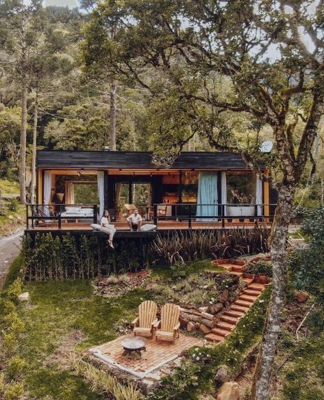 Black painted tiny house forest