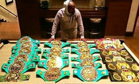 Floyd Mayweather with championship belts
