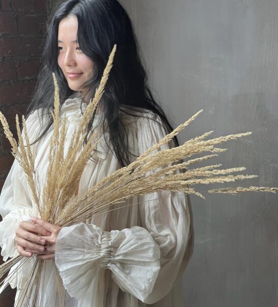 Girl holding grey plant