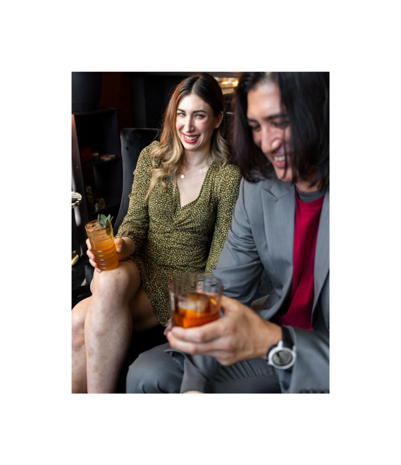 Guy and girl laughing with mocktail