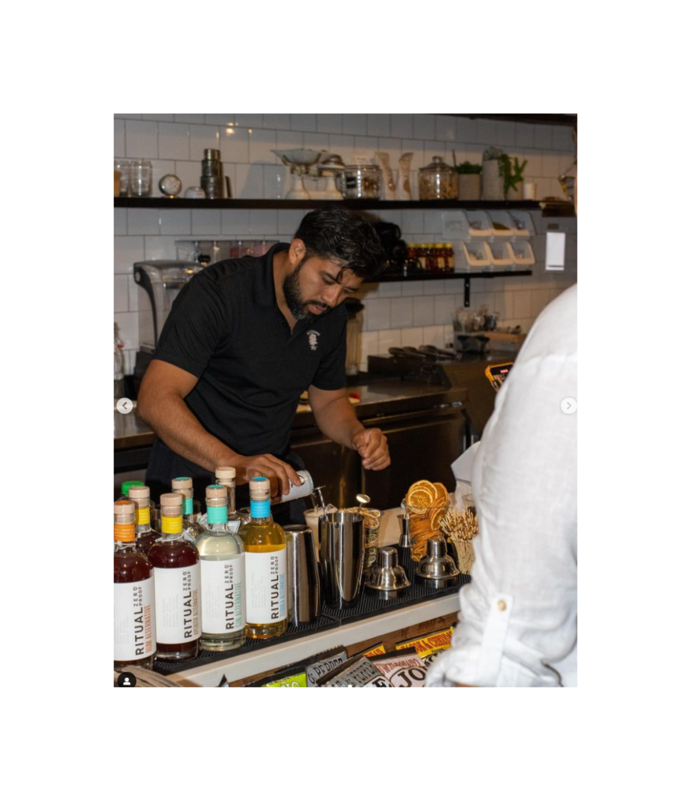 Pouring mocktail behind bar