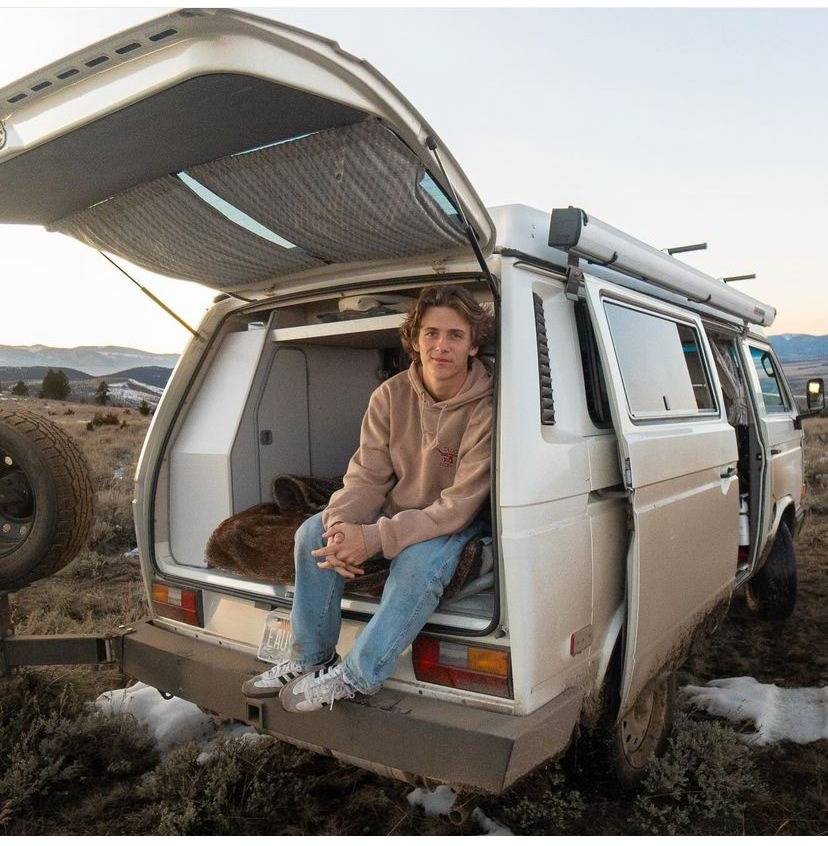 Vlogger guy sitting in van