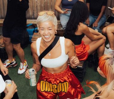 Woman partying in Muay Thai shorts