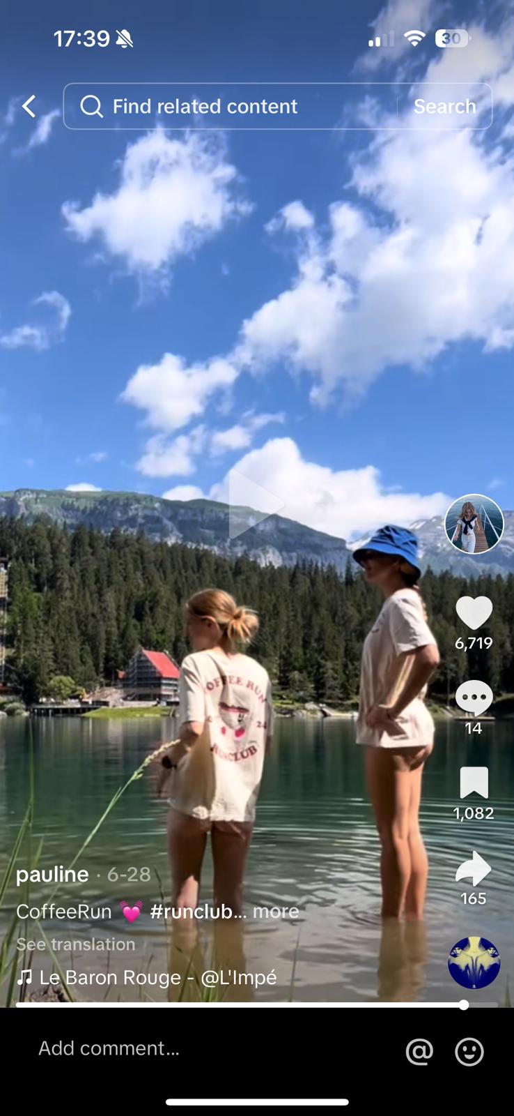 girls in lake with mountains around