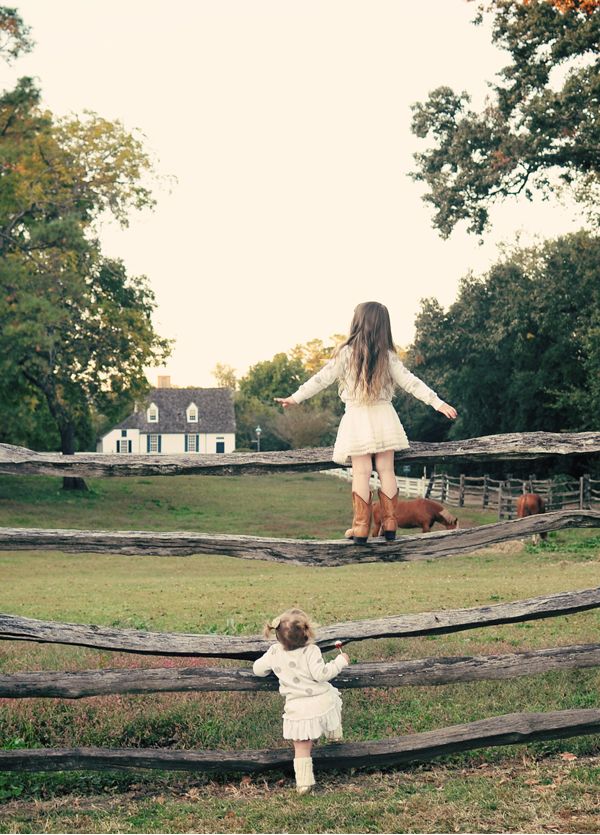 Little girls on the fence