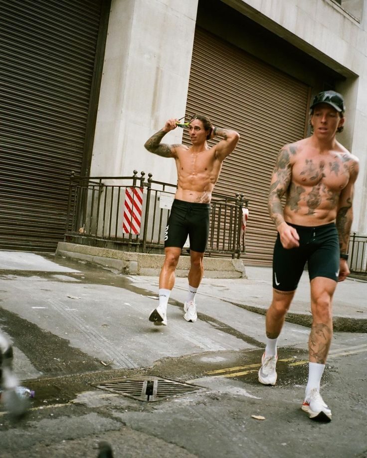 two-men-tattoo-running