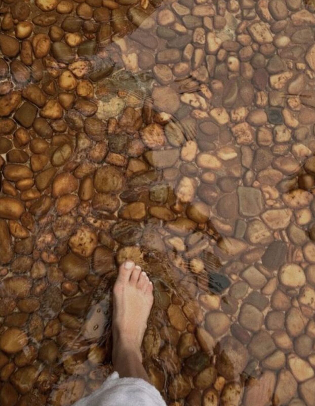 walking-barefoot-pebbles-water