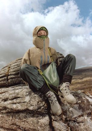 warm-raingear-chilling-rock